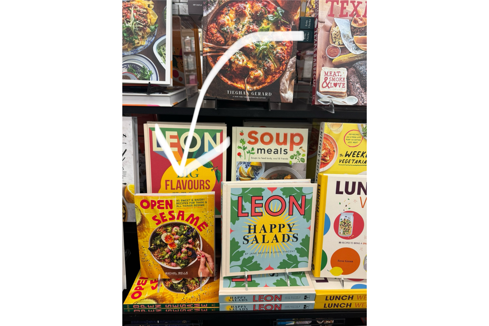 A shelf of cookbooks at a store
