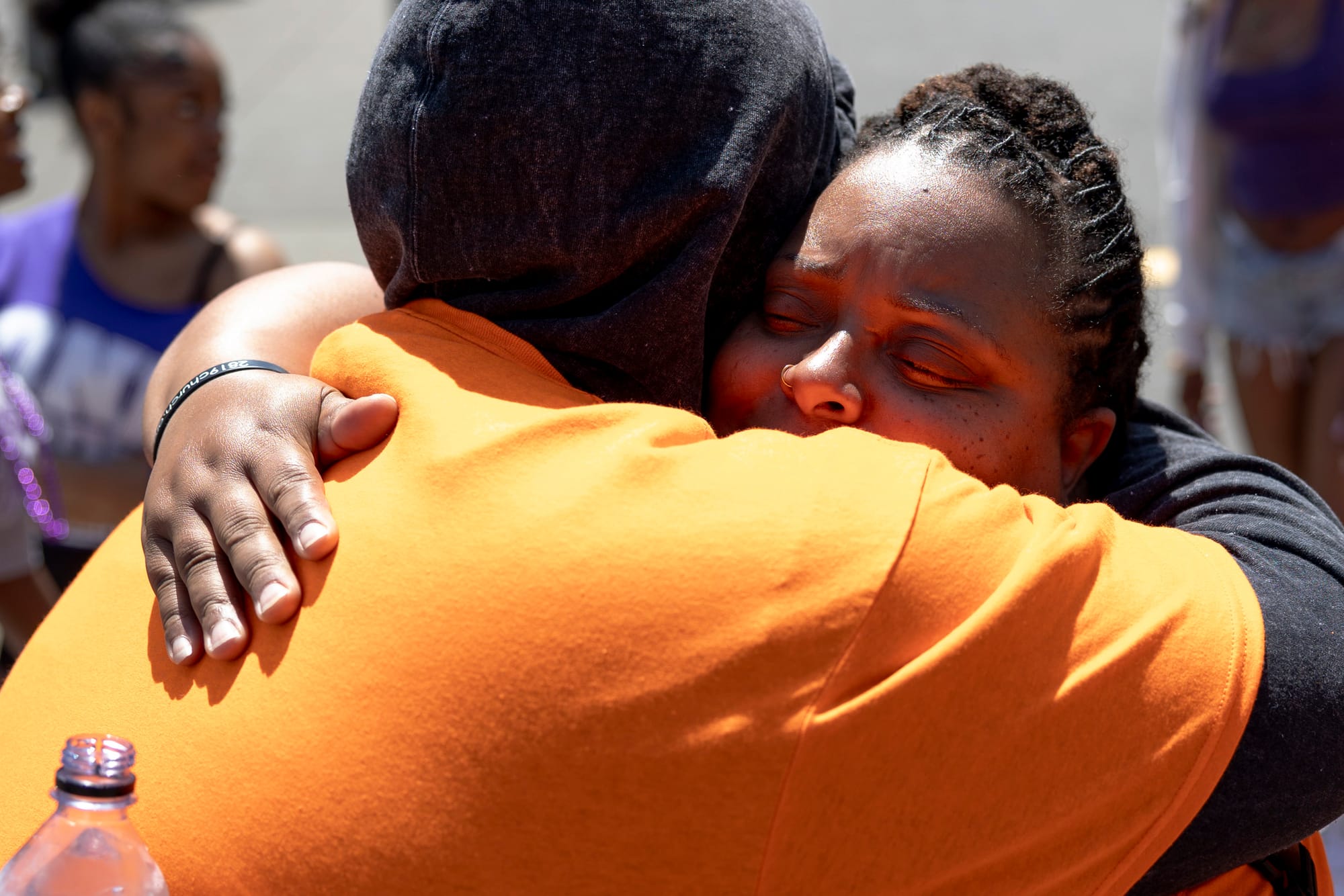 two people embrace in a hug