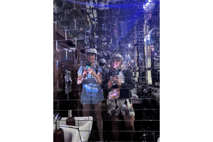 A mirror selfie in a bathroom full of disco balls
