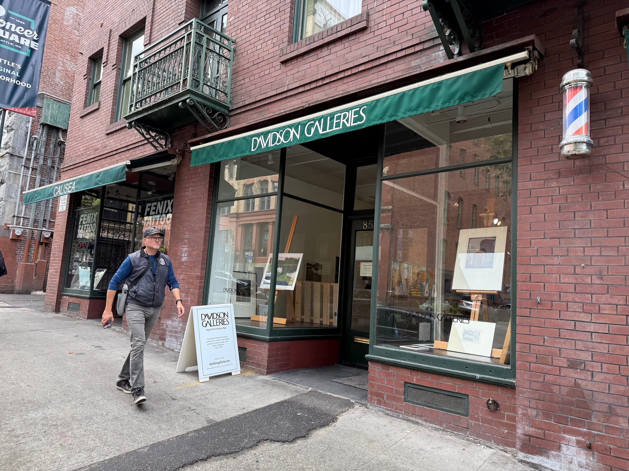 Photo of a brick building with a windowed storefront and an awning that says Davidson Galleries