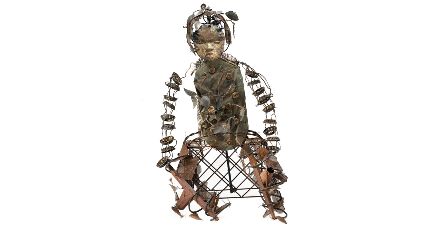 A sculpture made of many small interconnected pieces and wire