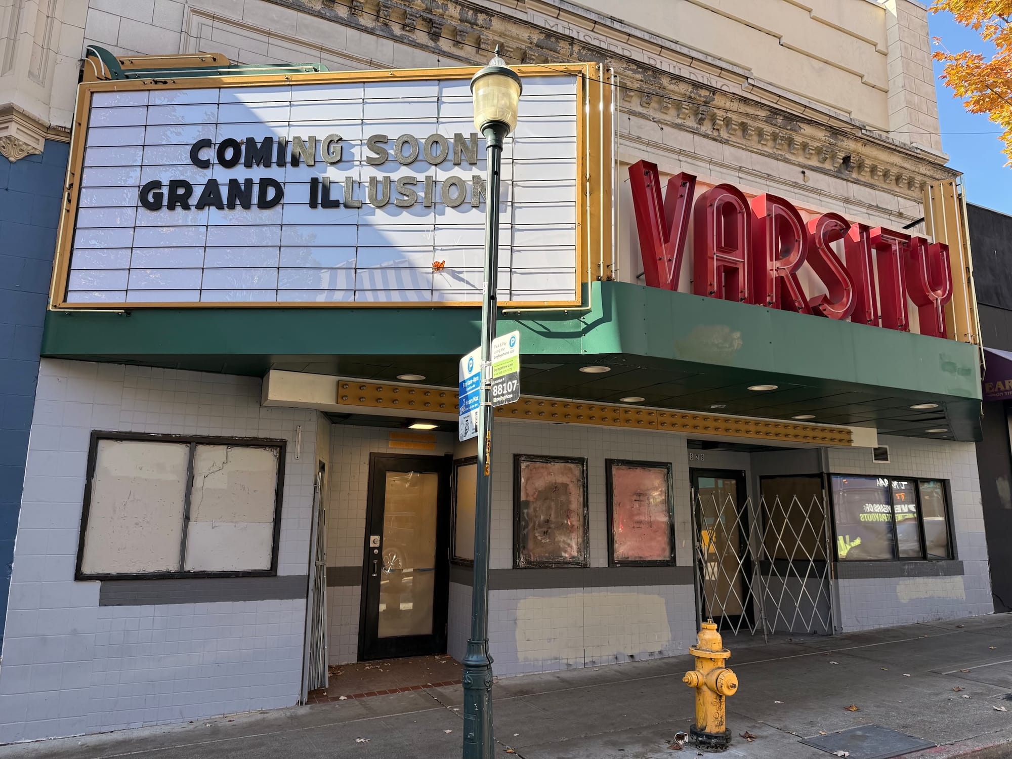 Photo of an old movie marquee that reads COMING SOON: THE GRAND ILLUSION