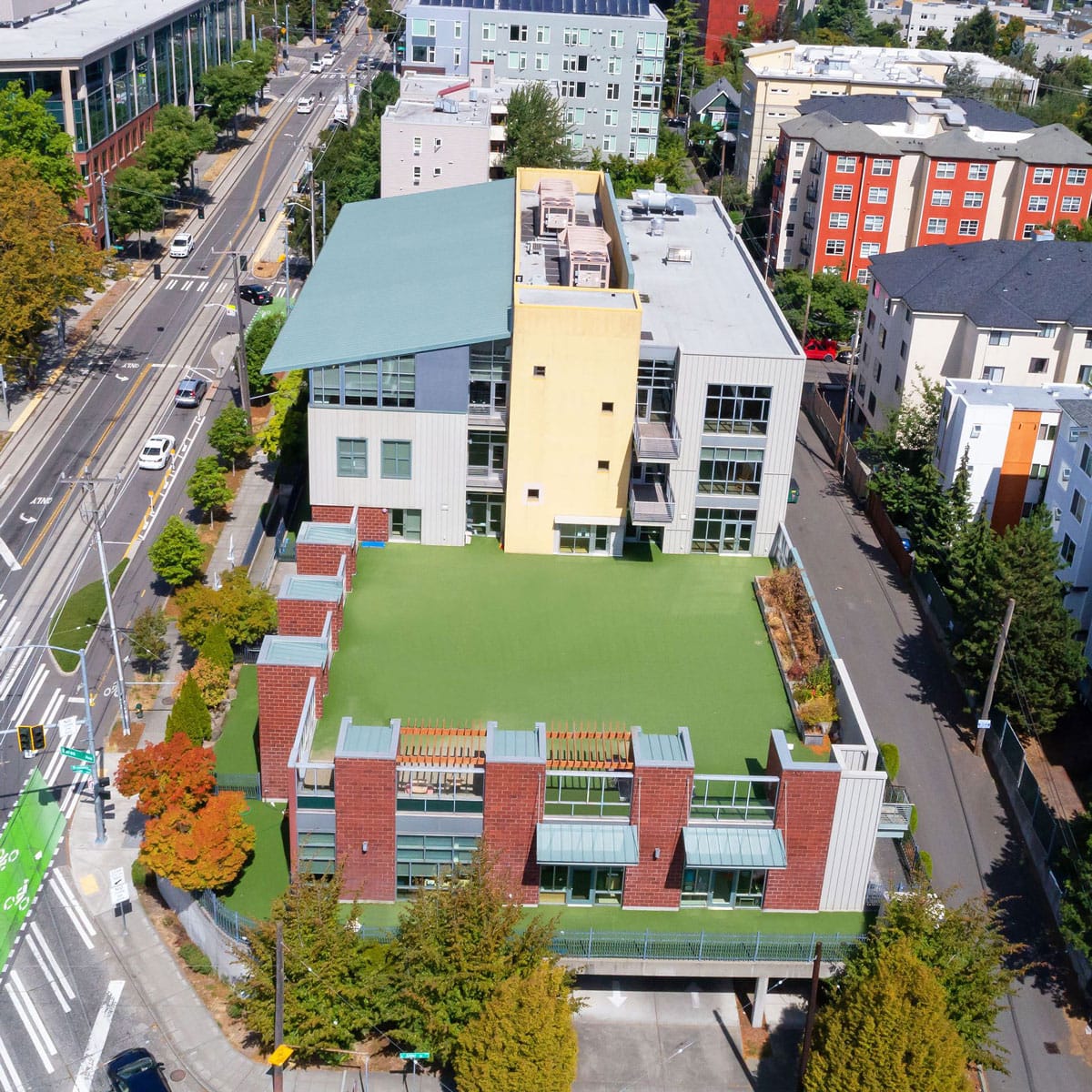 Cascade Public Media's new building, a large multistory building at a busy intersection, as seen from above
