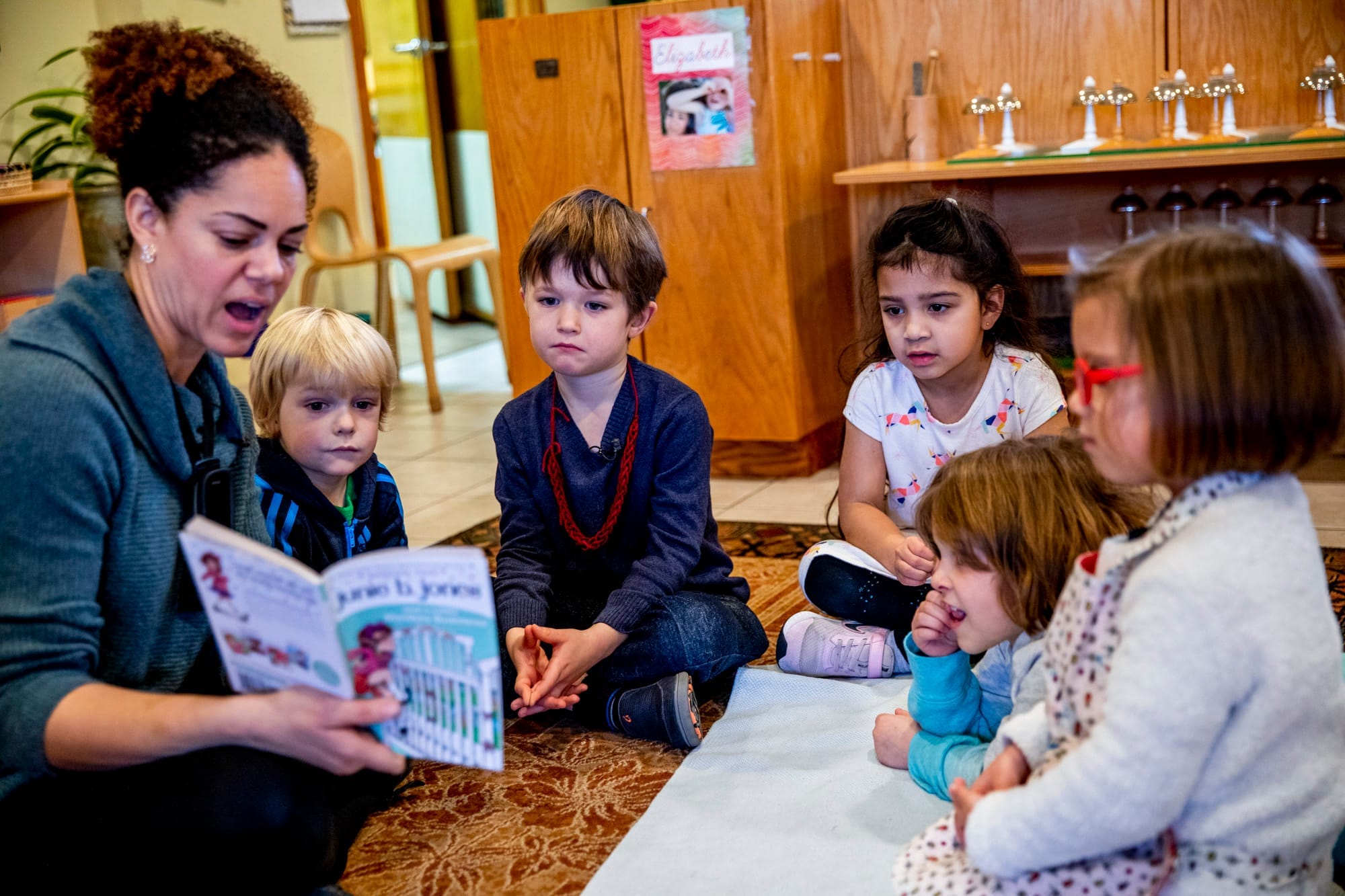 A teacher reading to a class