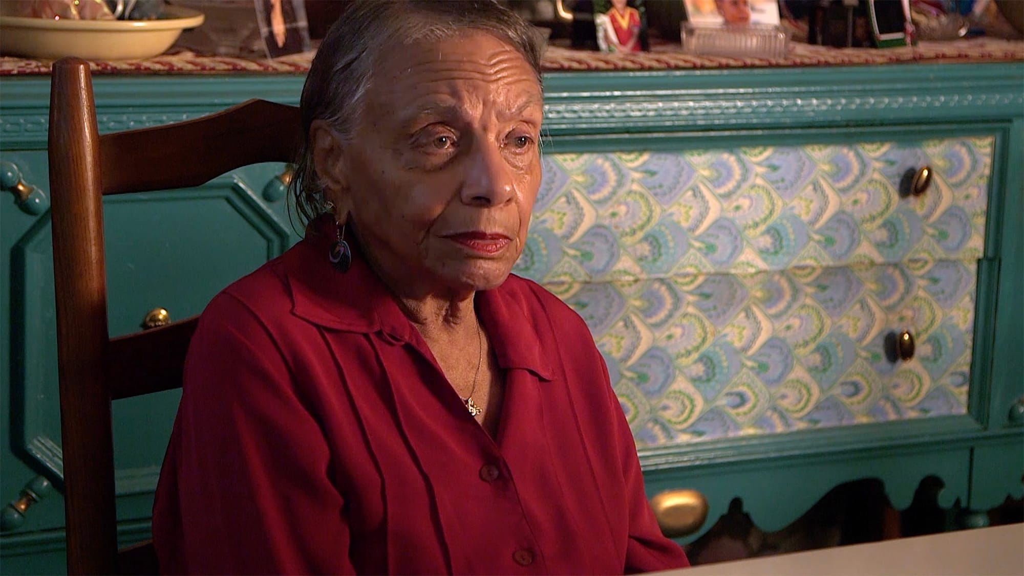 Close-up of woman in red shirt