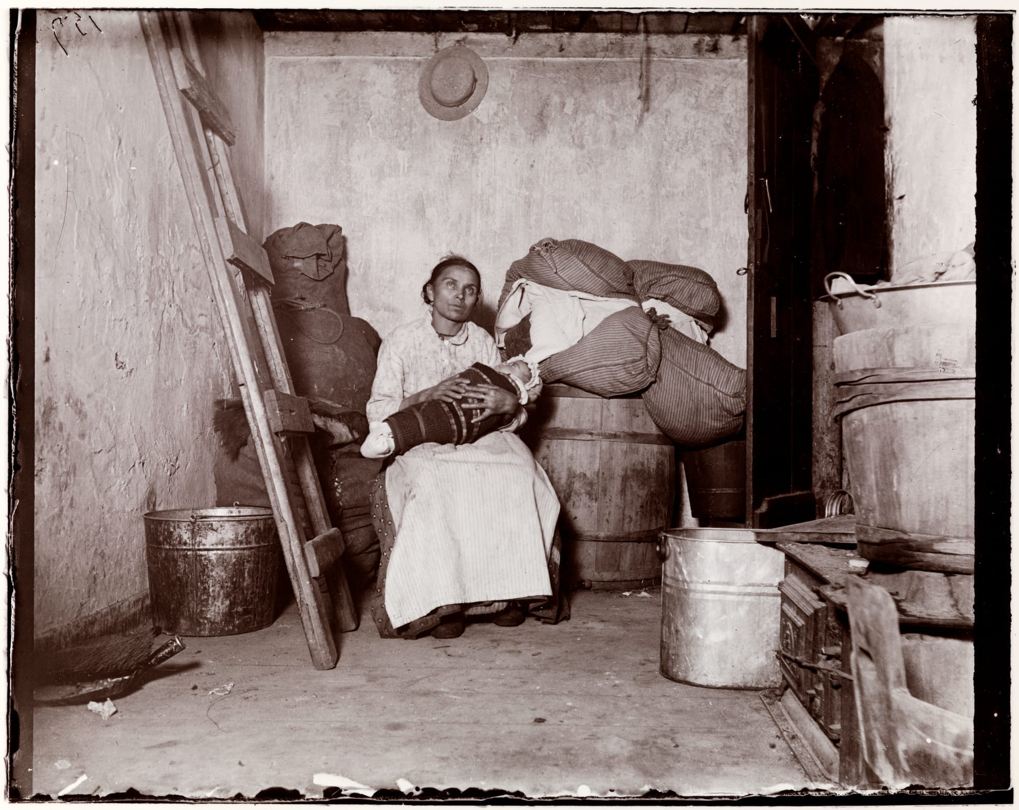 a black and white archival photo of a woman and baby