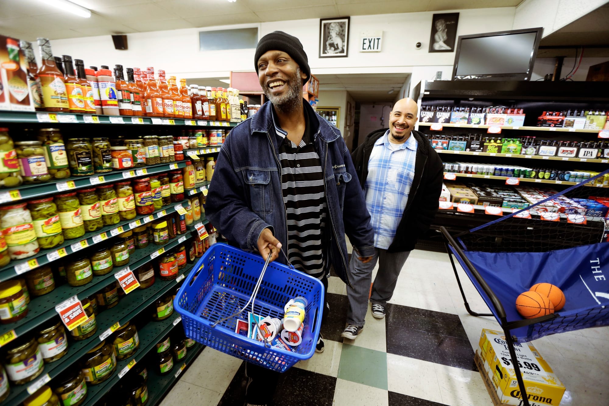 Man goes shopping in store with his caseworker