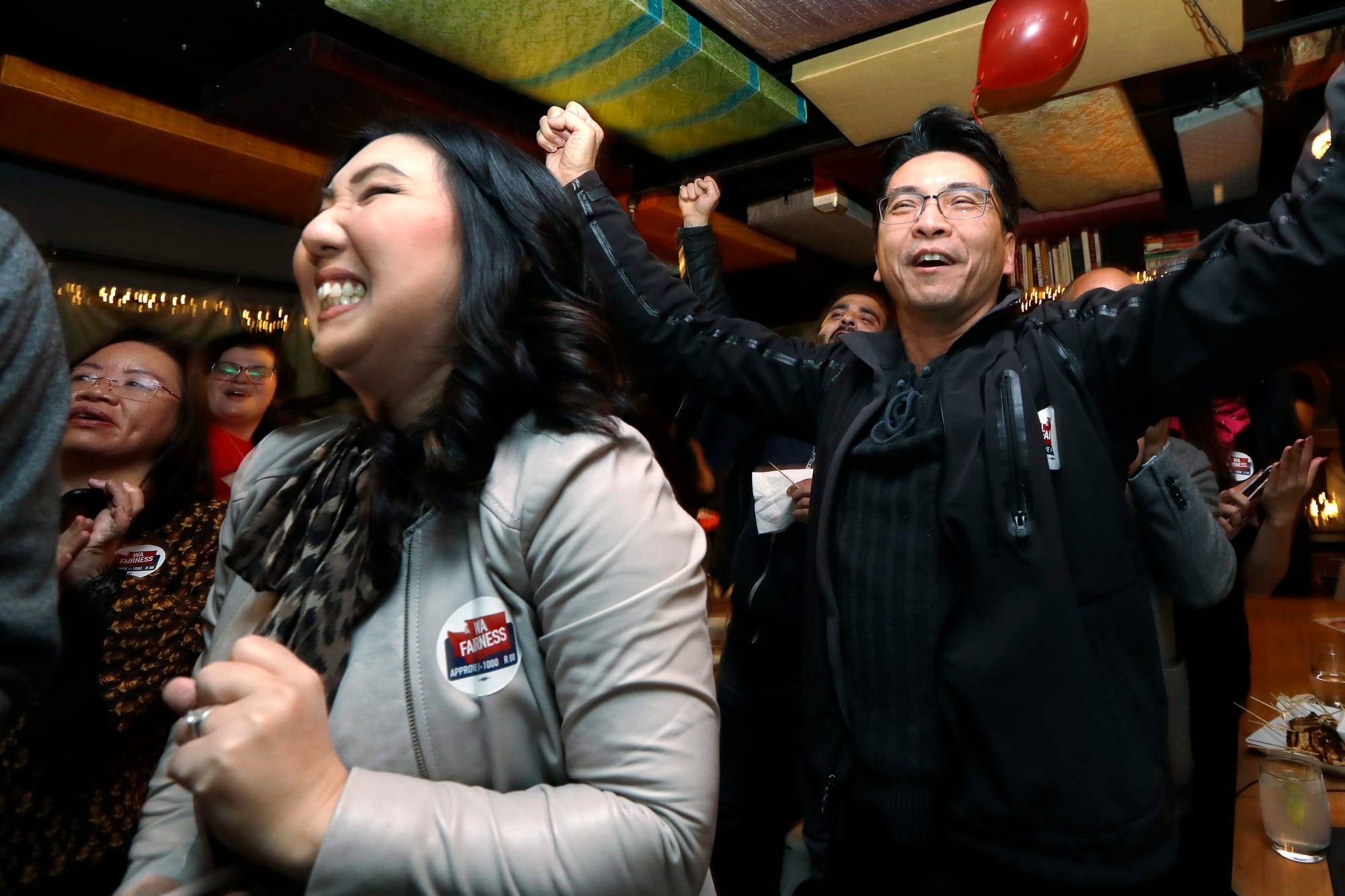 Supporters of Referendum 88 react positively to early returns.