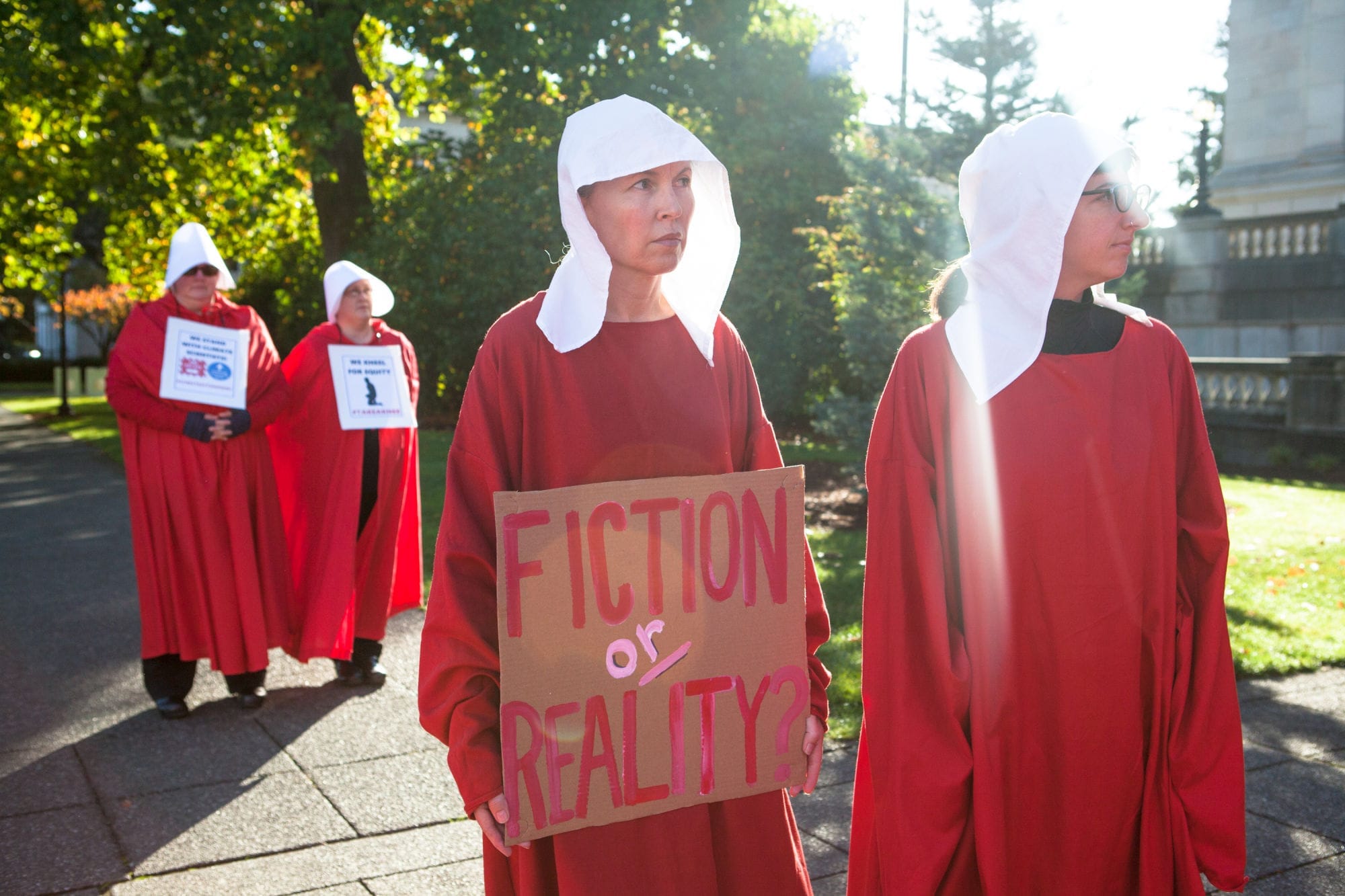 Connie Phegley and Alexis Sarah, both of Olympia, walk as a pair at 50 Handmaids in 50 States.