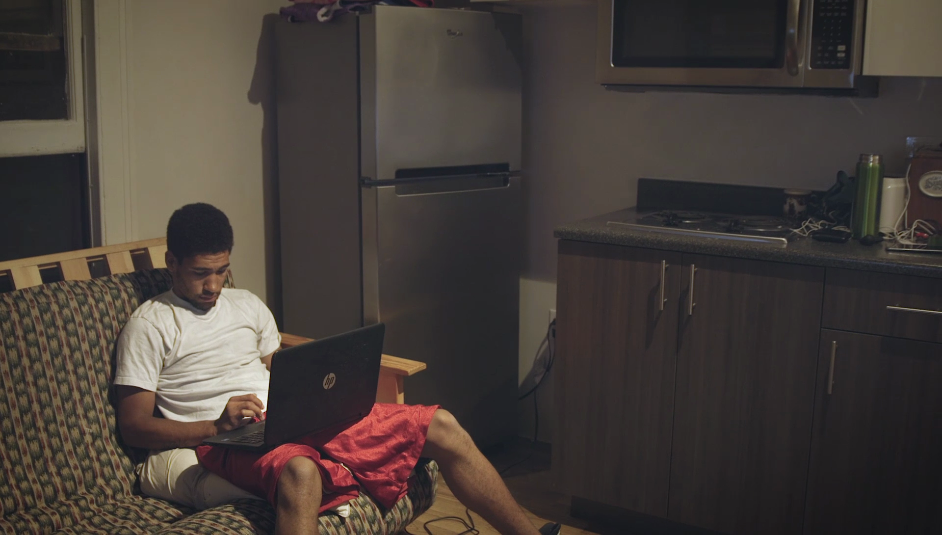 Corey on his laptop at home