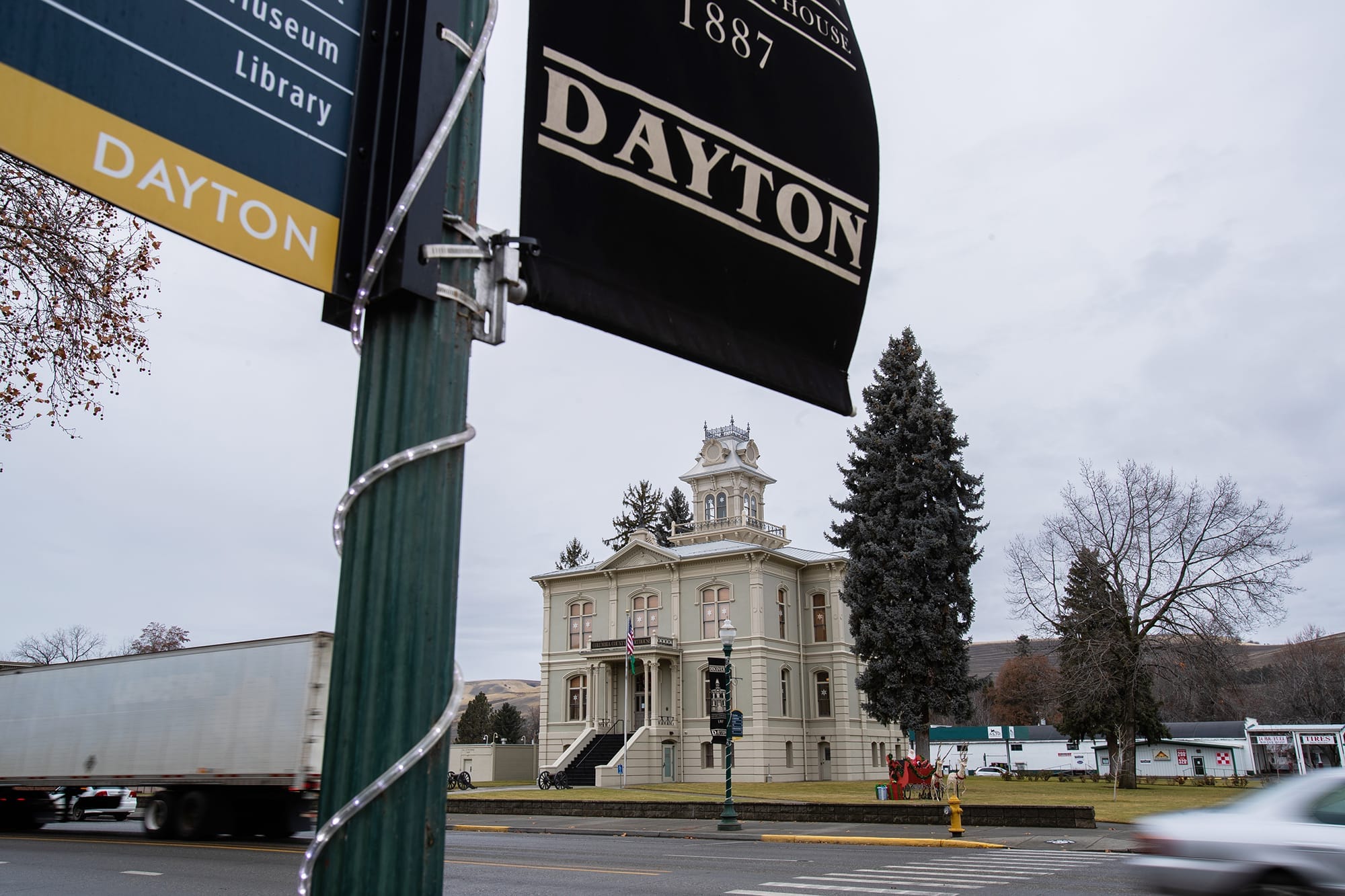 A Dayton city flag flies in front of the Columbia County courthouse