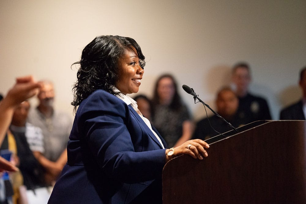 Executive Director of the Northwest African American Museum Lanesha Debardelaben introduces the new police chief.
