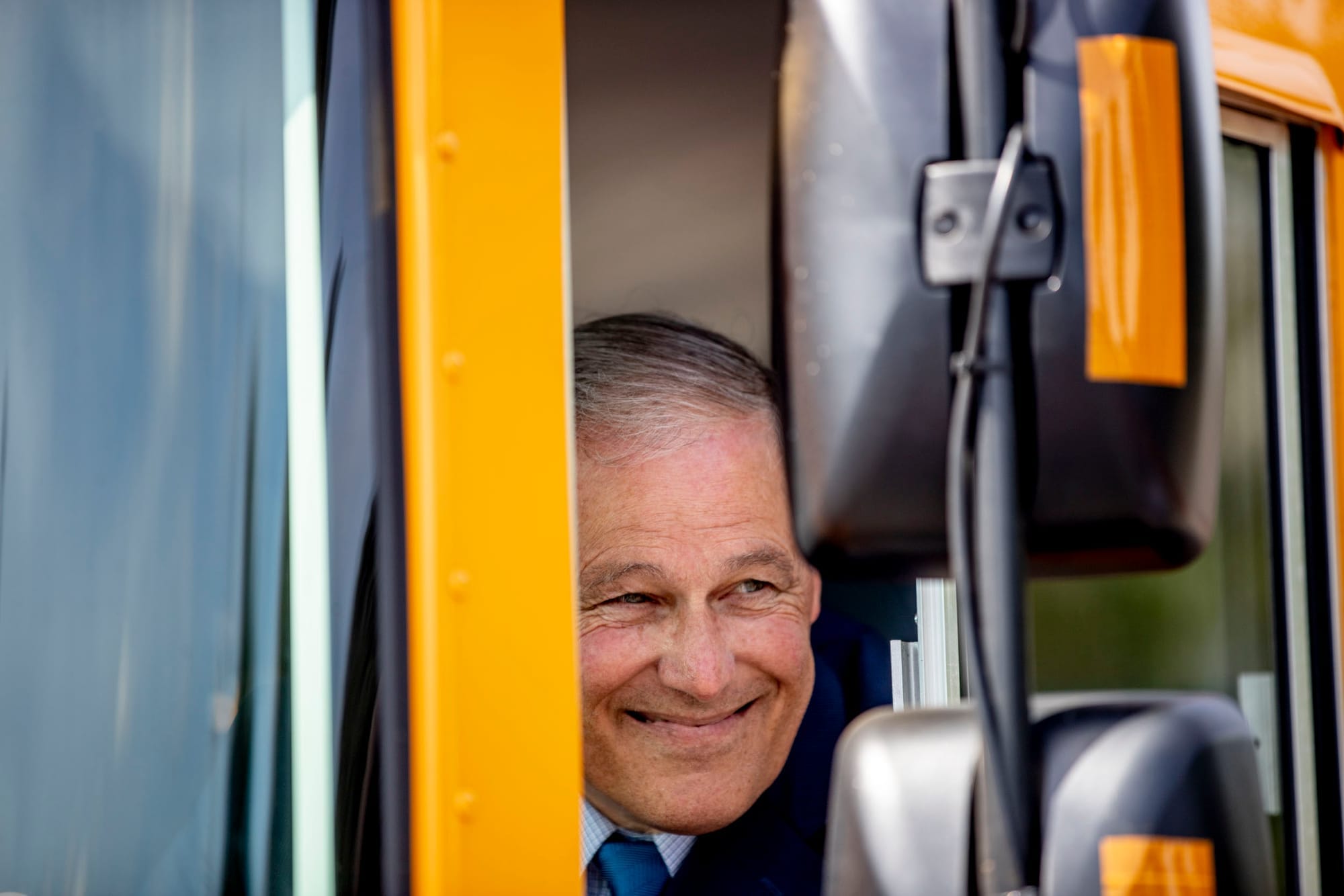 Governor Jay Inslee inside the first electric school bus in Washington state during an event at Franklin Pierce High School in Tacoma on June 17, 2019. (Photo by Dorothy Edwards/Crosscut)