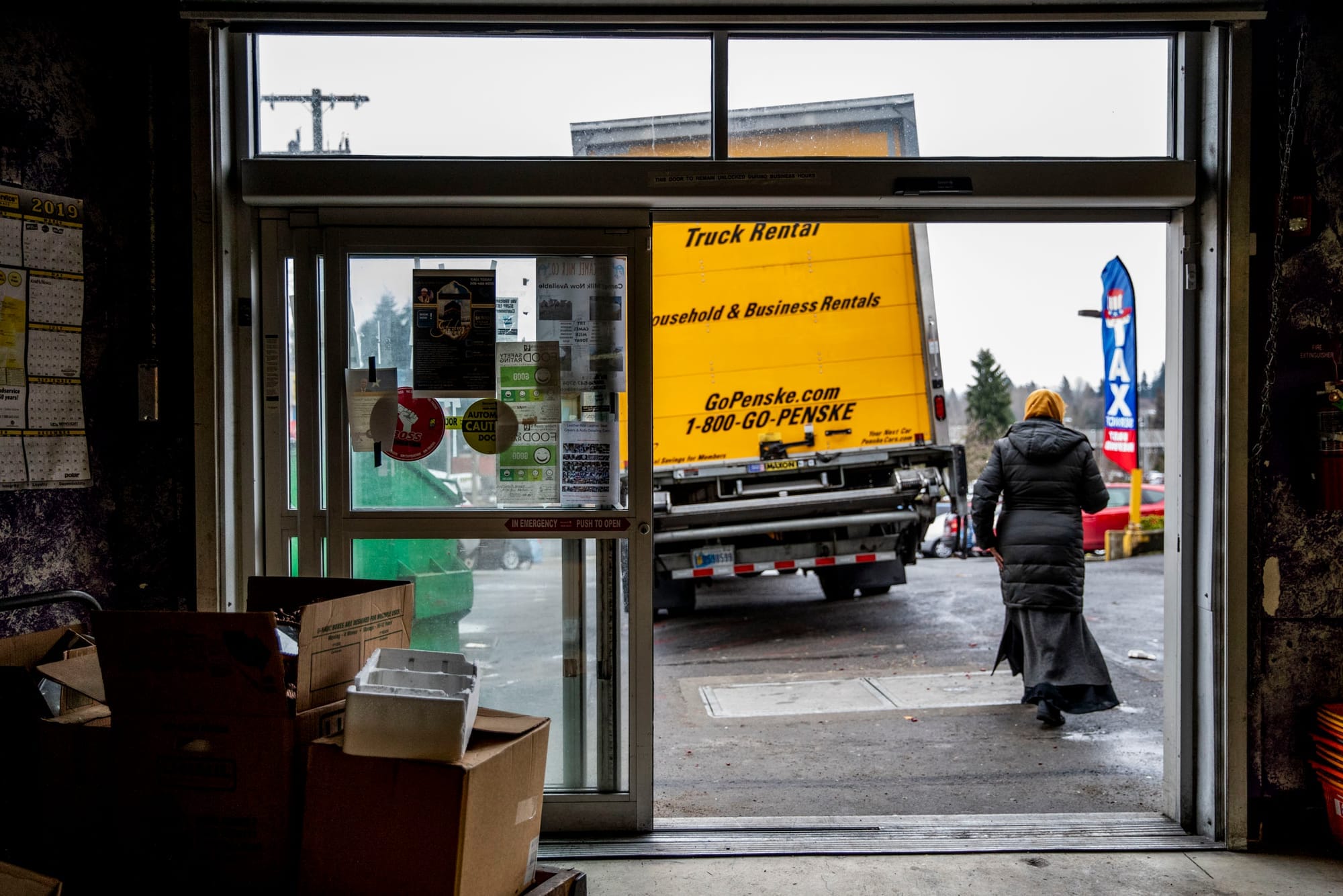 Owner Sahra Abdulle walks out of SeaTac Market.