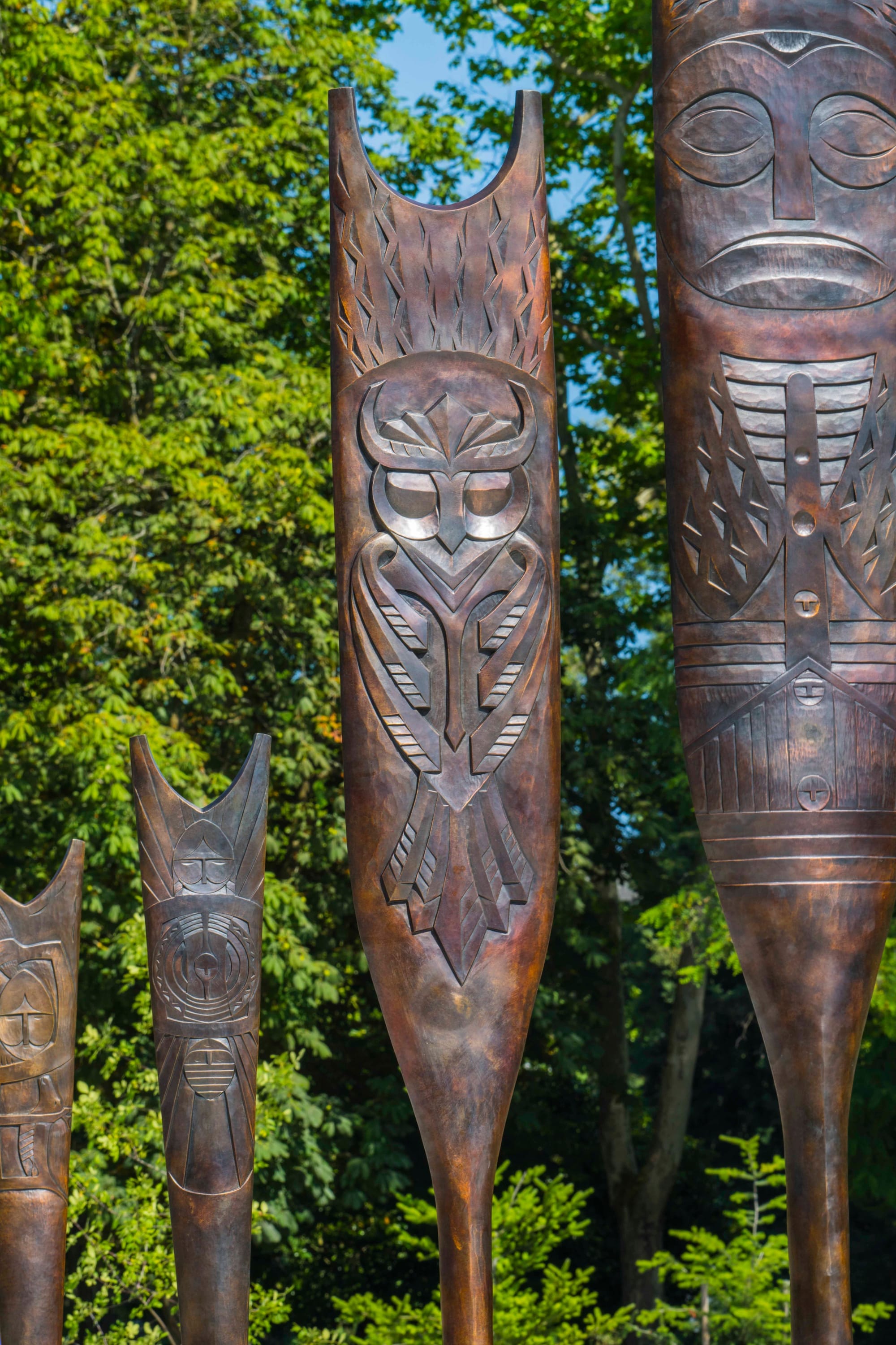 Bronze paddles with intricate designs