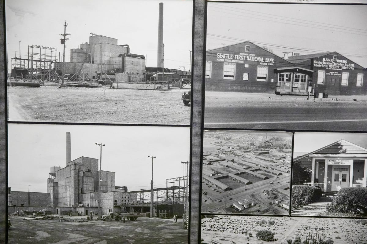 Black and white photos of the B Reactor, a rather unassuming rectangular building, at the Hanford site on Wednesday, Oct. 12, 2022.