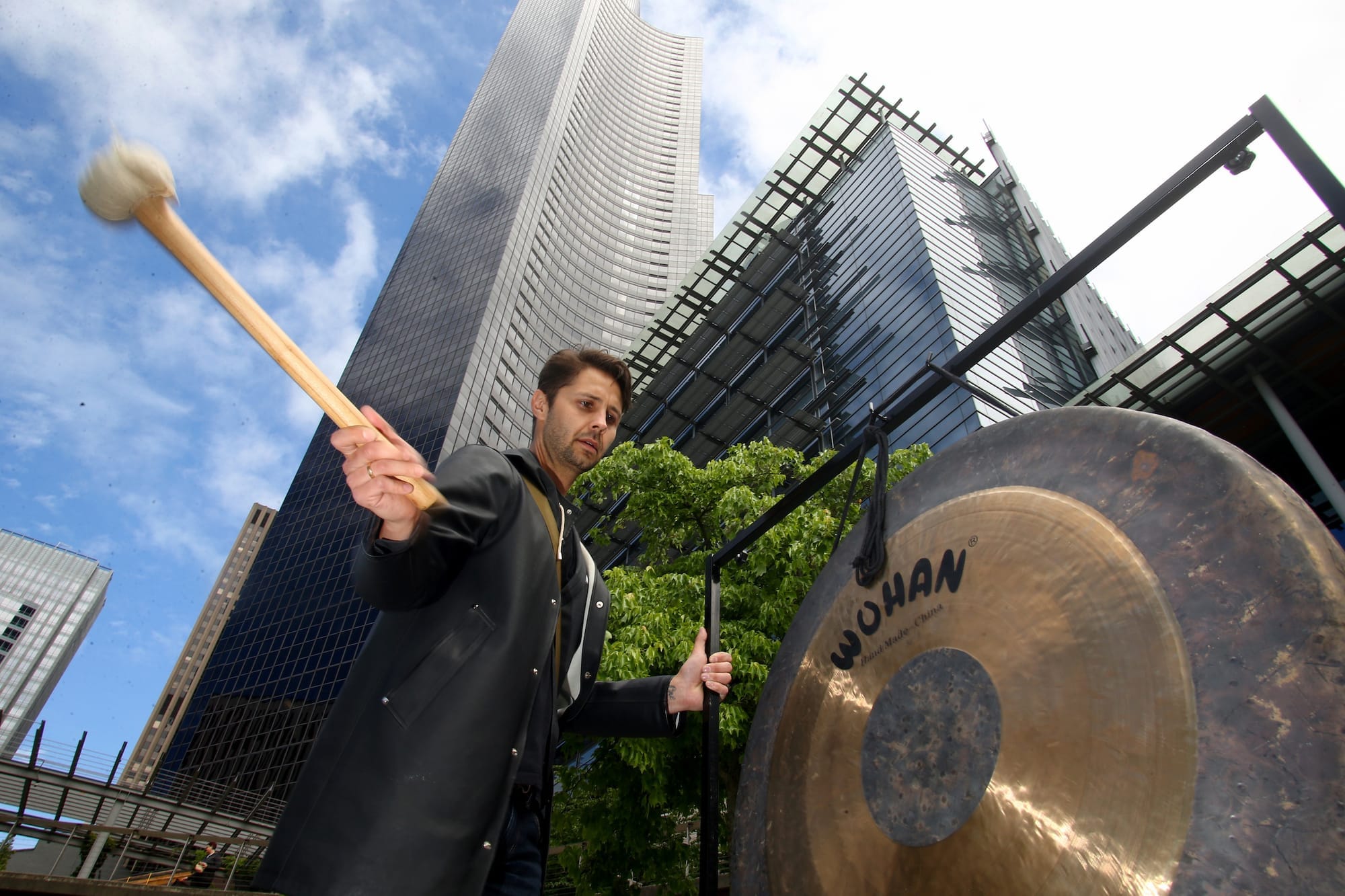 A man strikes the gong