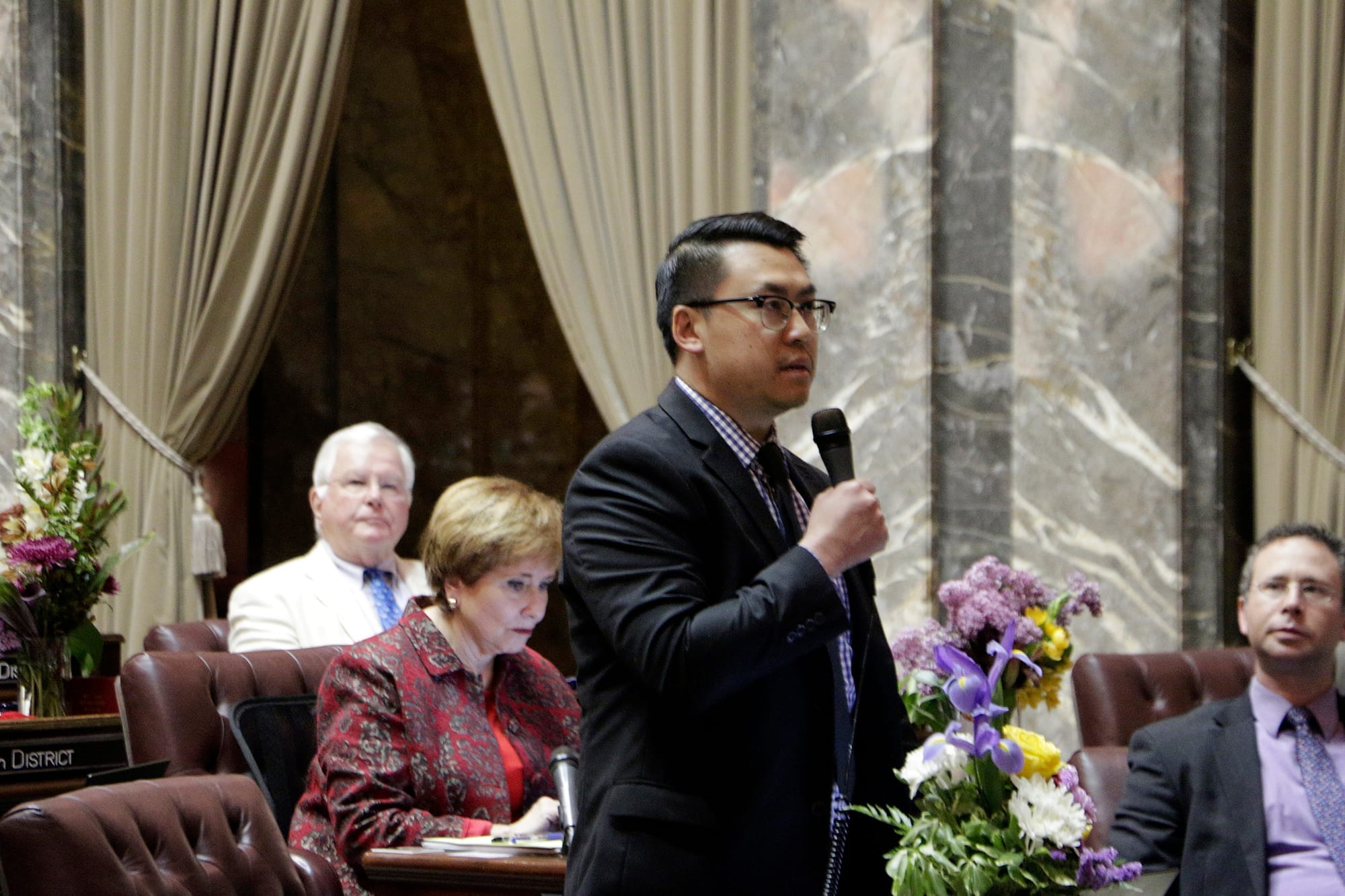 Democratic Sen. Joe Nguyen speaks in support of an initiative to the Legislature that would allow the state to use hiring and recruitment goals, but not quotas, to bring minority candidates into state jobs and education, on April 28, 2019, in Olympia. The measure loosens restrictions enacted in a 1998 initiative that banned government discrimination or preferential treatment based on factors such as race or gender. (Photo by Rachel La Corte/AP)