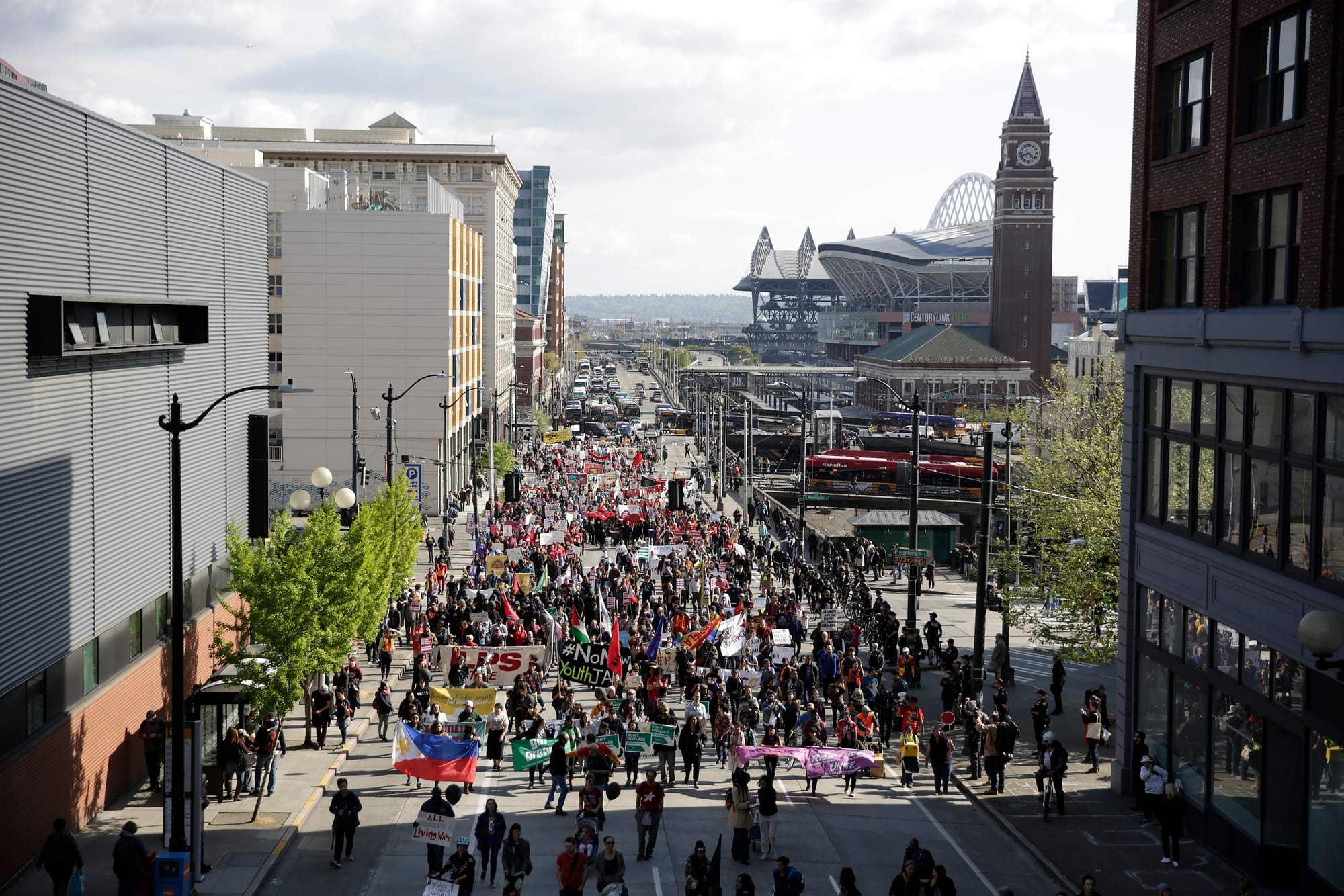 Marchers make their way onto 4th Avenue South from South Jackson Street during the annual May Day March for Workers and Immigrant Rights in Seattle, May 1, 2018.