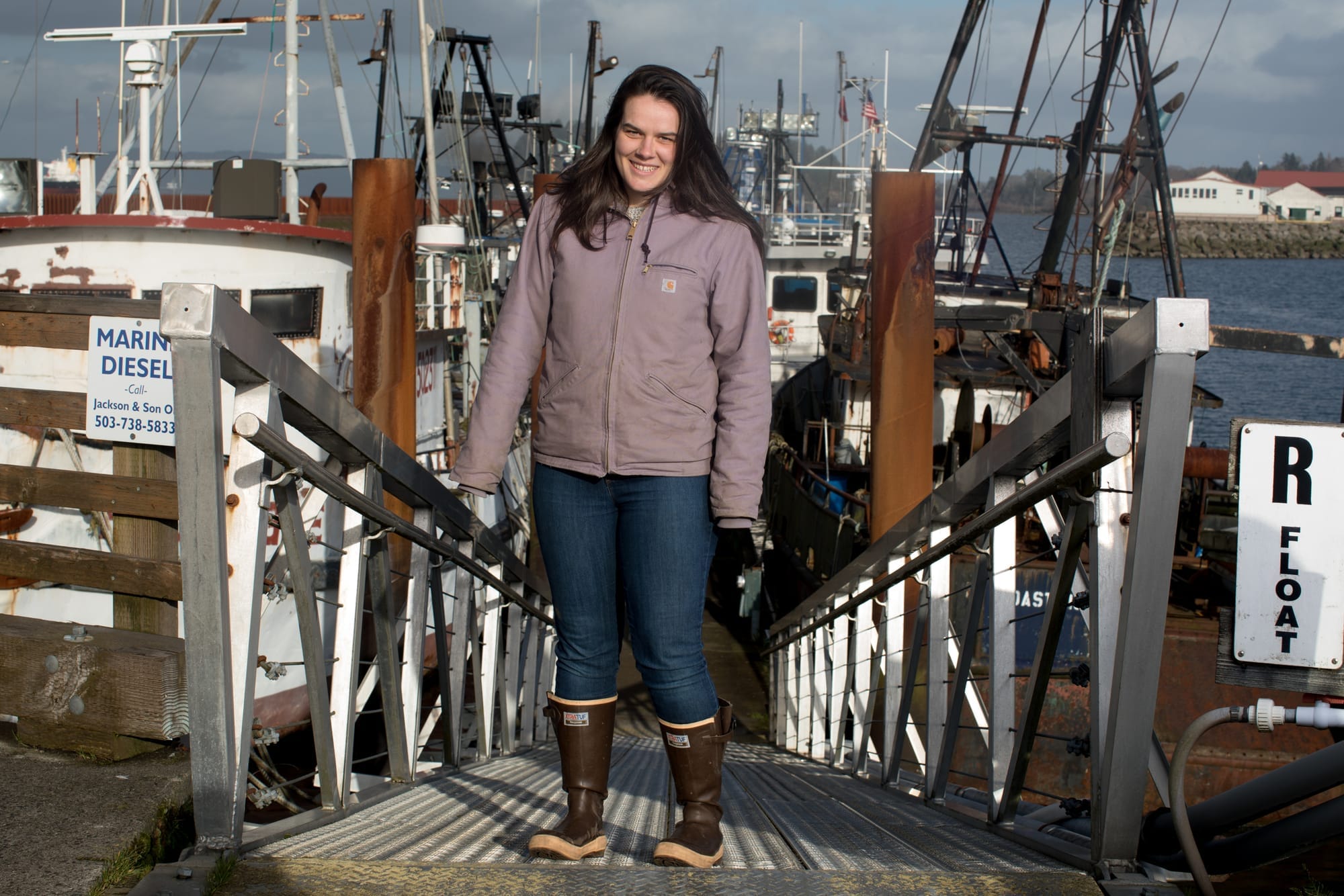 Maggie Bursch of Bellingham, Washington stands for a portrait in the East Mooring Basin of Astoria.