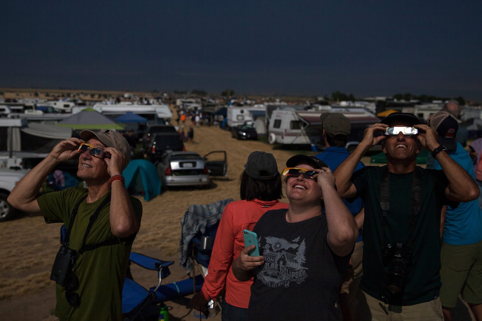 people with eclipse-watching glasses