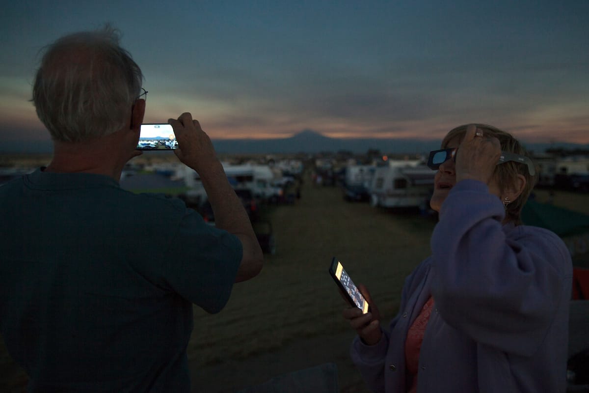 And old couple taking a picture of the view