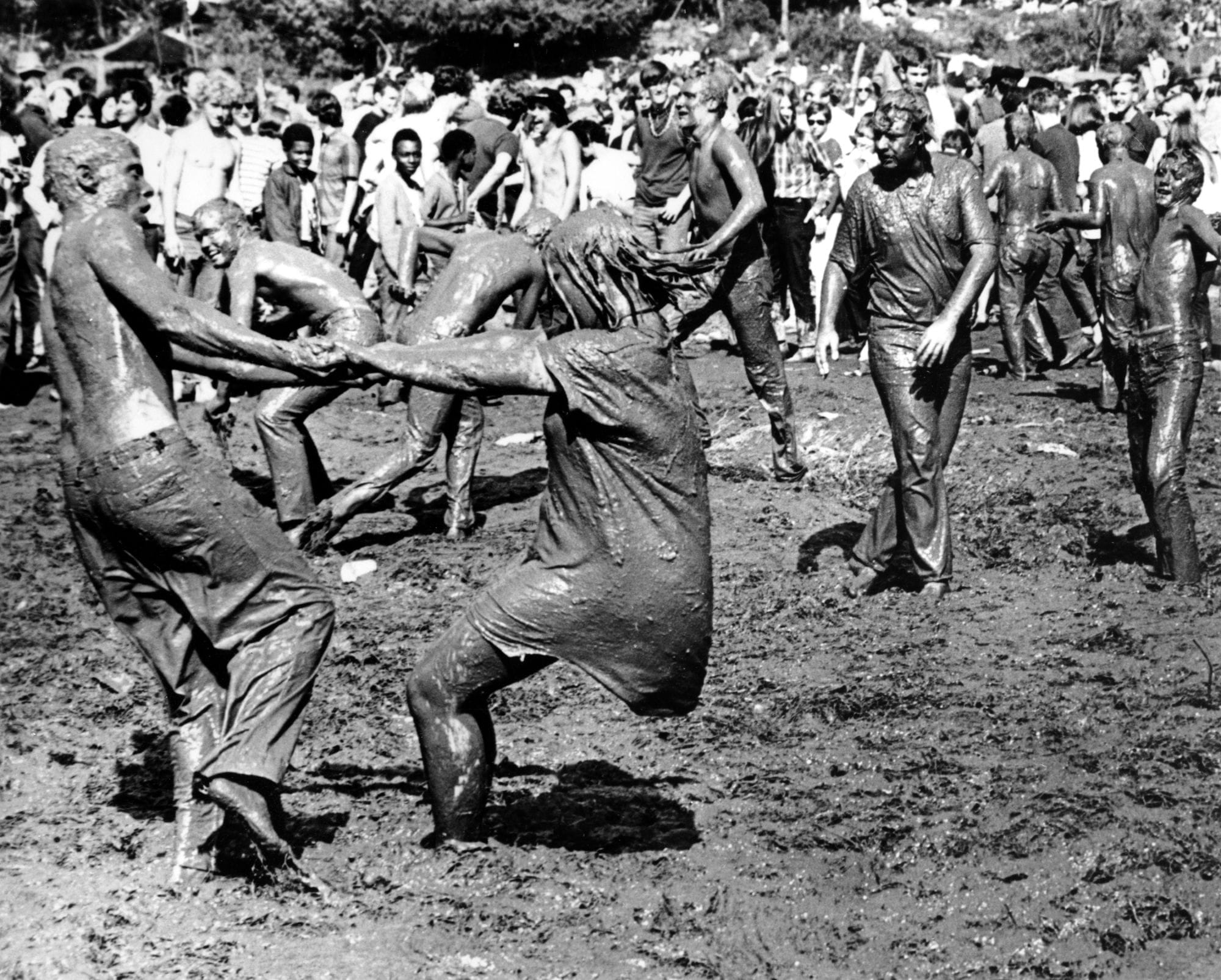People cover in mud