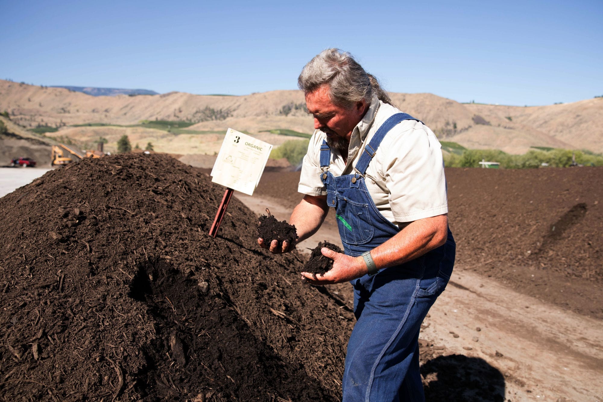 Kyle Mathison grabs two handfuls of his special blend