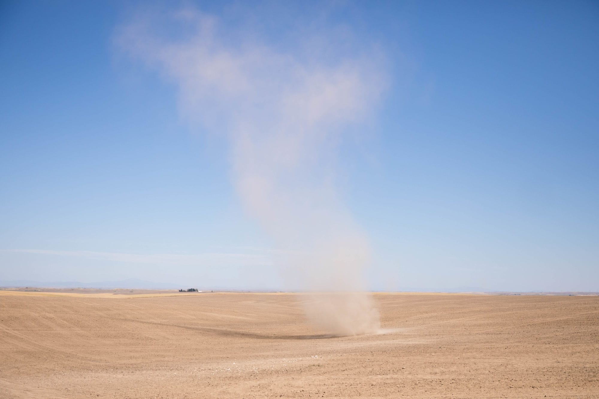 Dust devils whip along Highway 2