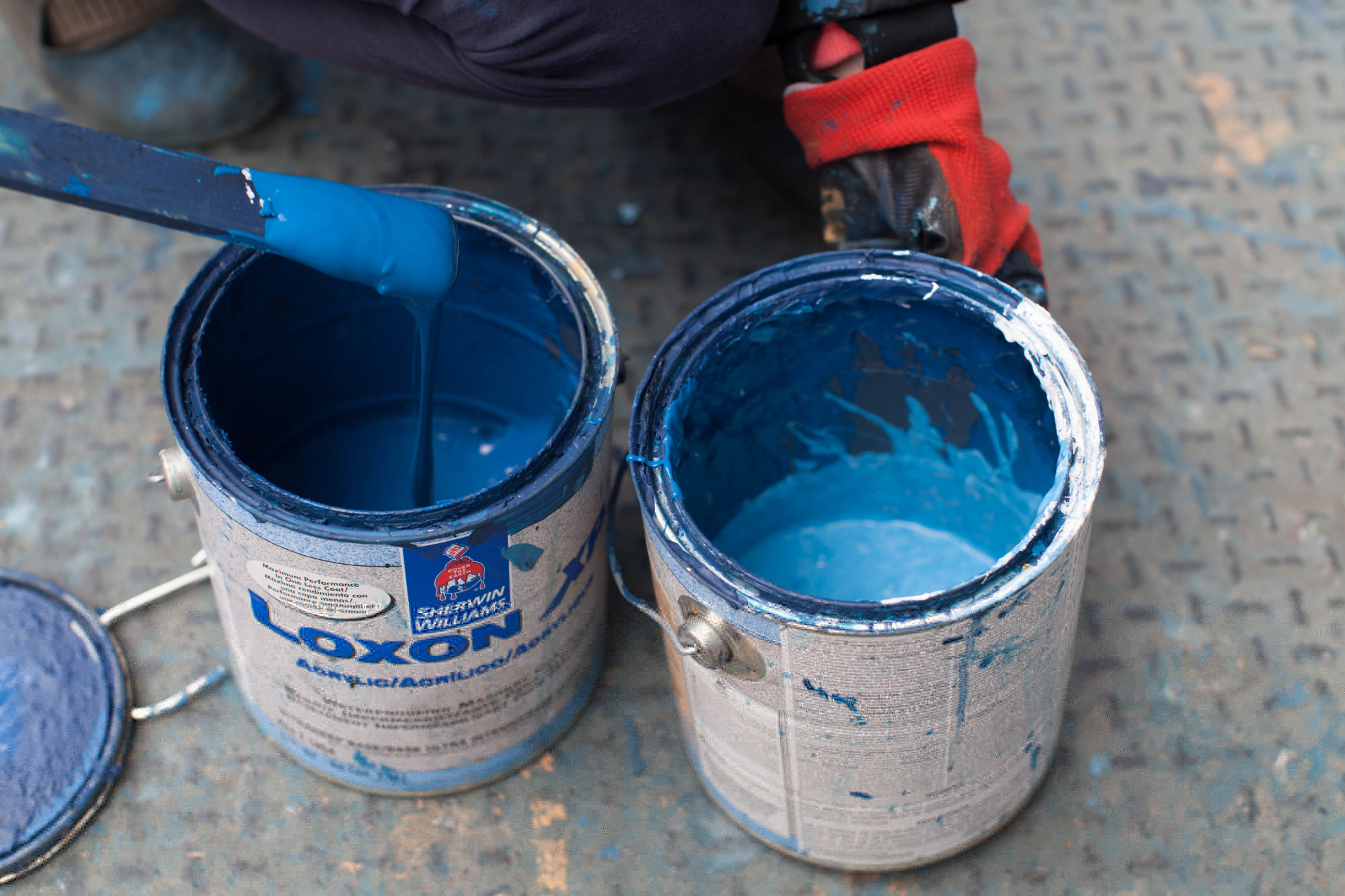 Tins of blue paint