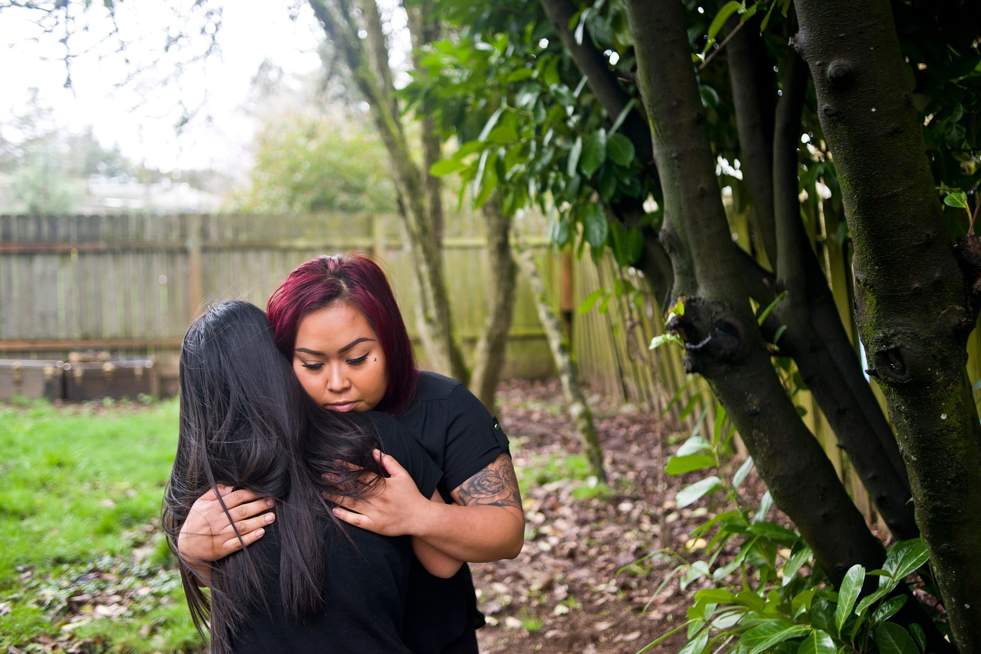 Sun Khliu is surrounded by family members in a photograph displayed at the home of his daughter, Bopha Khliu, in Portland, Ore. on Friday, February 16, 2018. Sun Khliu is currently being held at the Northwest Detention Center in Tacoma and is facing potential deportation to Cambodia. (Samuel Wilson for Crosscut)