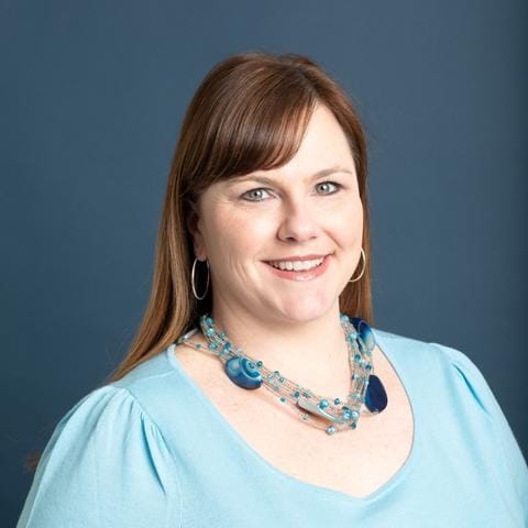 A portrait of Kerry O'Keefe, Cascade Public Media's VP of Philanthropy