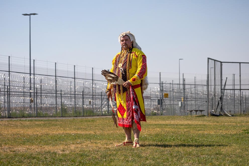 Jeremy Garretson stands in regalia