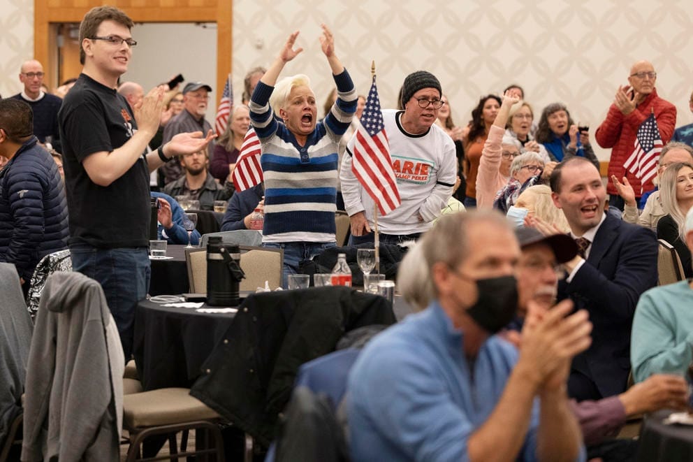 A group of people cheer