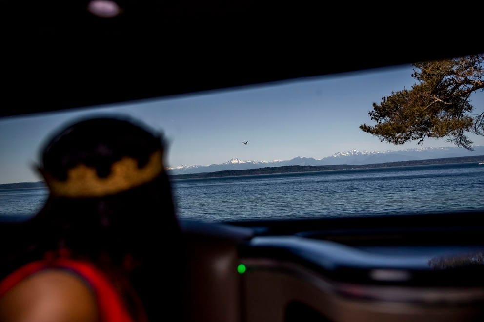 Alesia looks out the window of a stretch Hummer