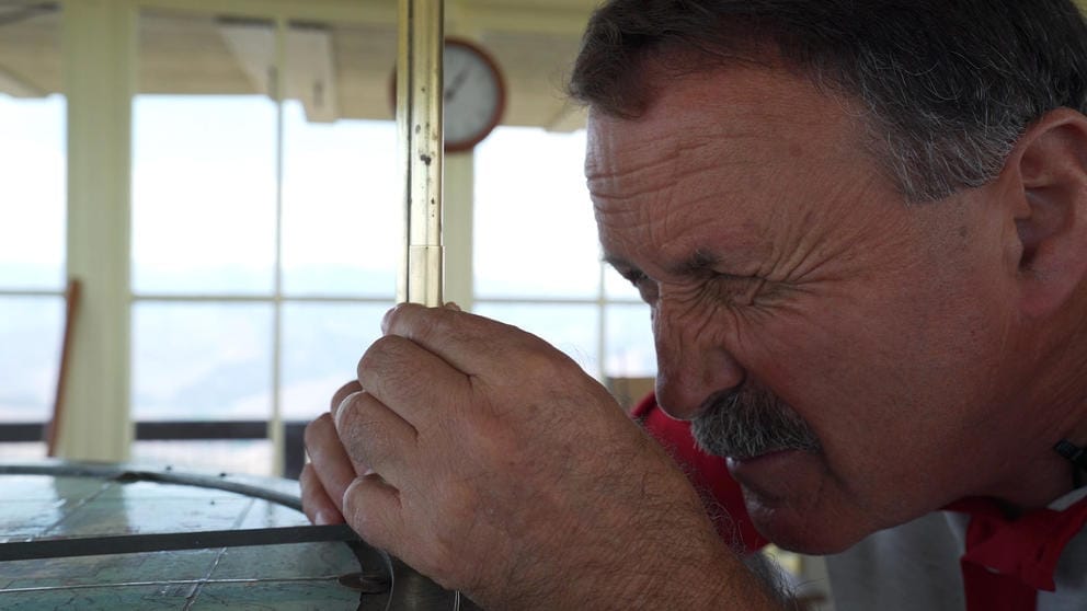 Bill Austin looks through his Osborne Fire Finder