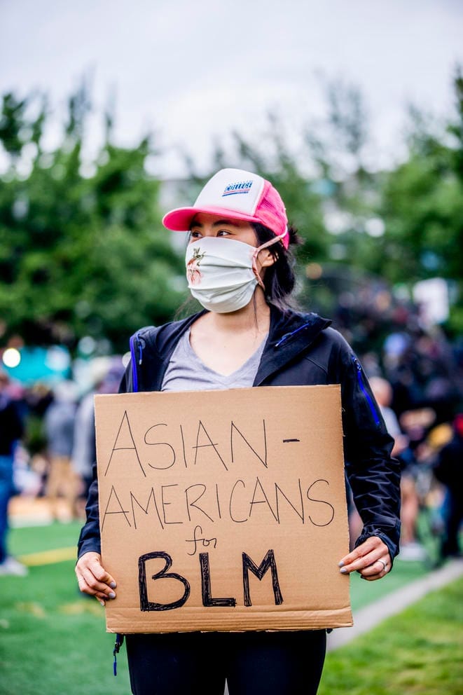 Portrait of a protester holding a sign