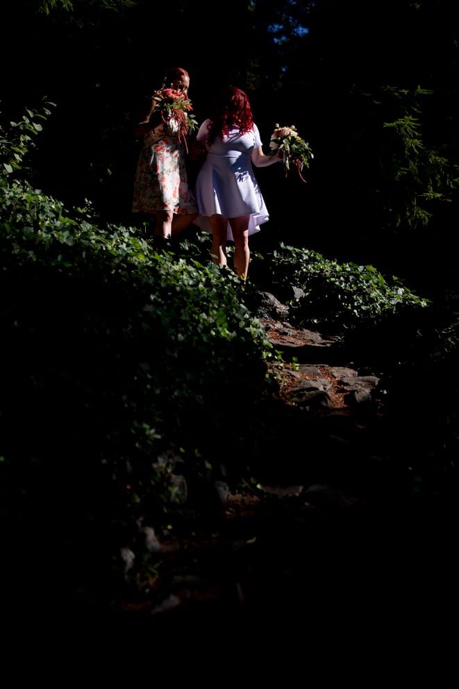 Jessica and Maia walk down their cobblestone path
