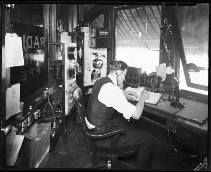 Man on radio, black and white
