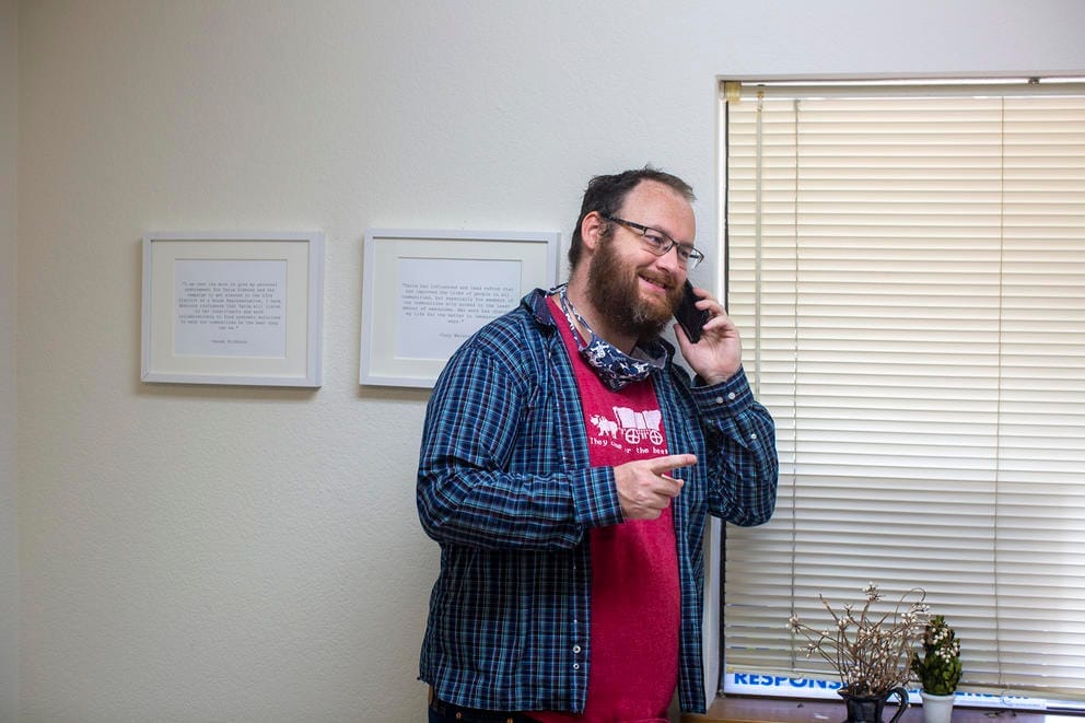 Jeff Beaulac talks on the phone in a campaign office