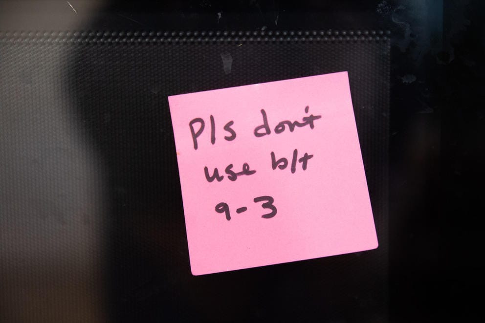 A pink post it note reads,