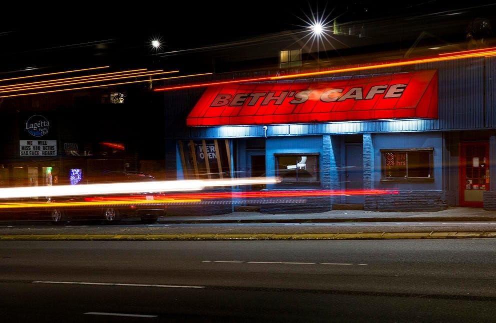 Beth's Cafe facade at night