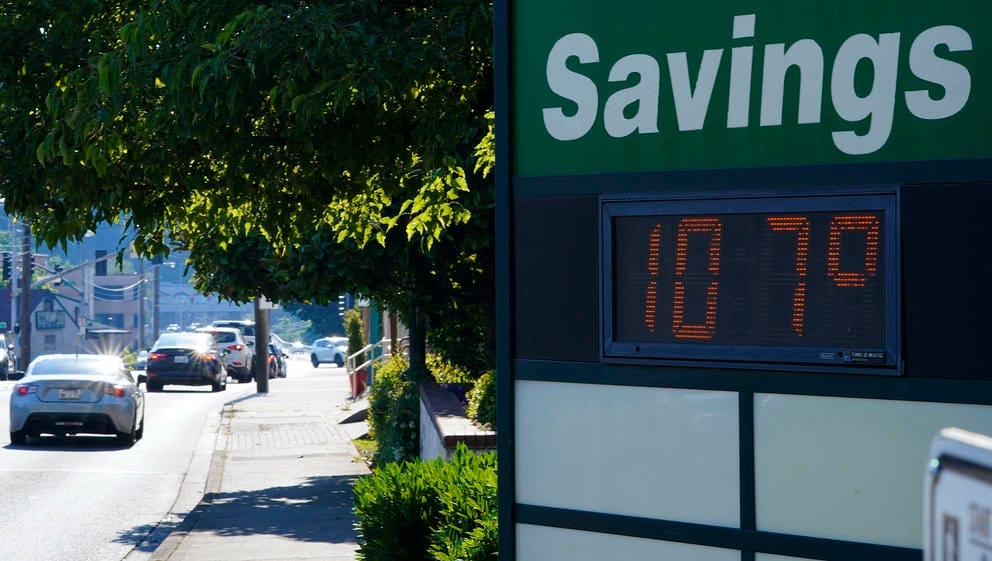 a sign showing the temperature outdoors. The sign reads 107 degrees. 