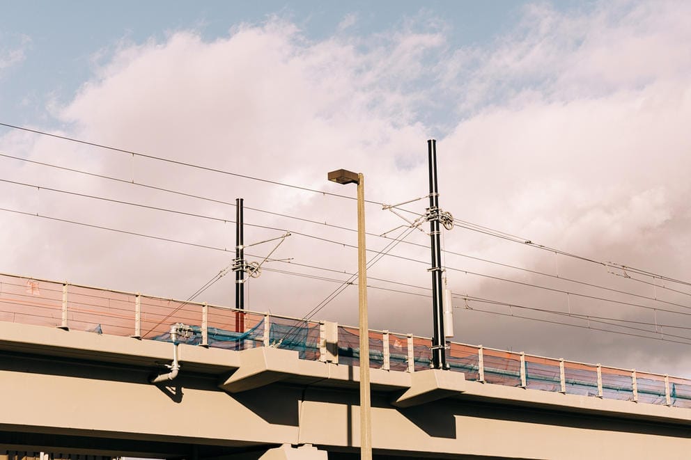 A concrete train track with the sky above