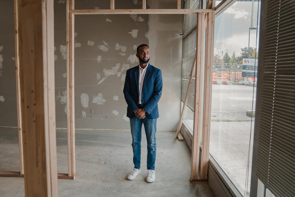 man standing at the site of a future vendor stall