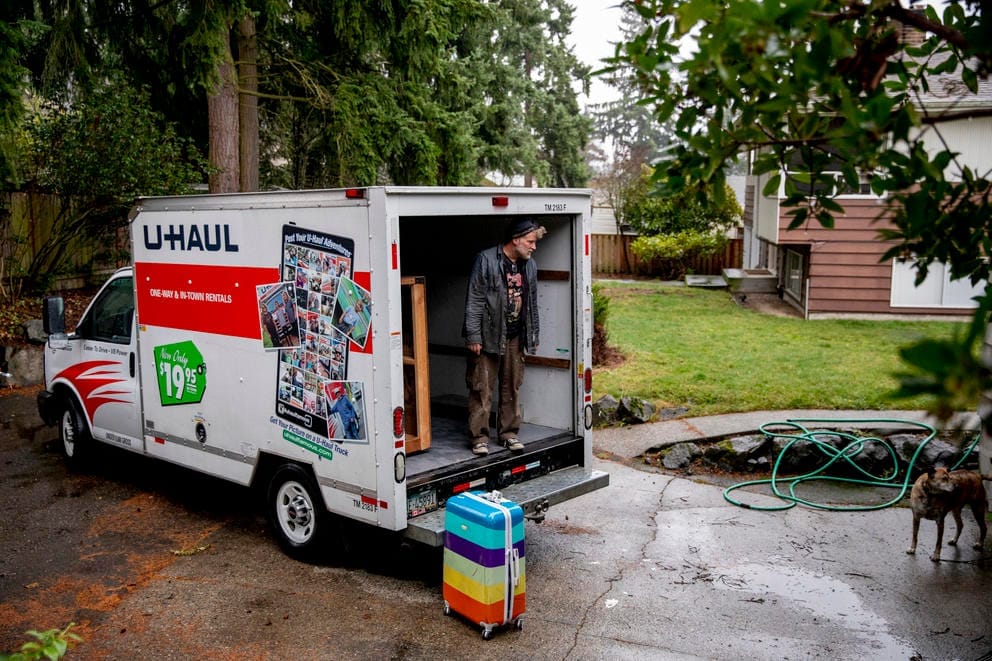 Mulkerin stands in the back of a U-haul truck