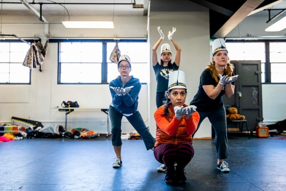 four dancers together in a pose