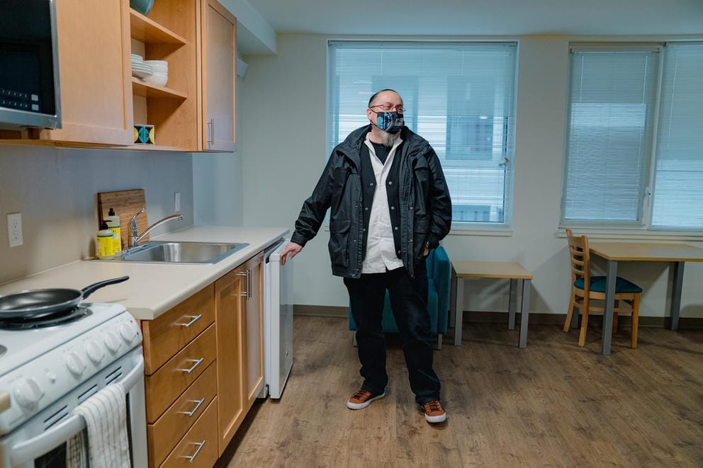 Derrick Belgarde shows a unit within the ʔálʔal housing development