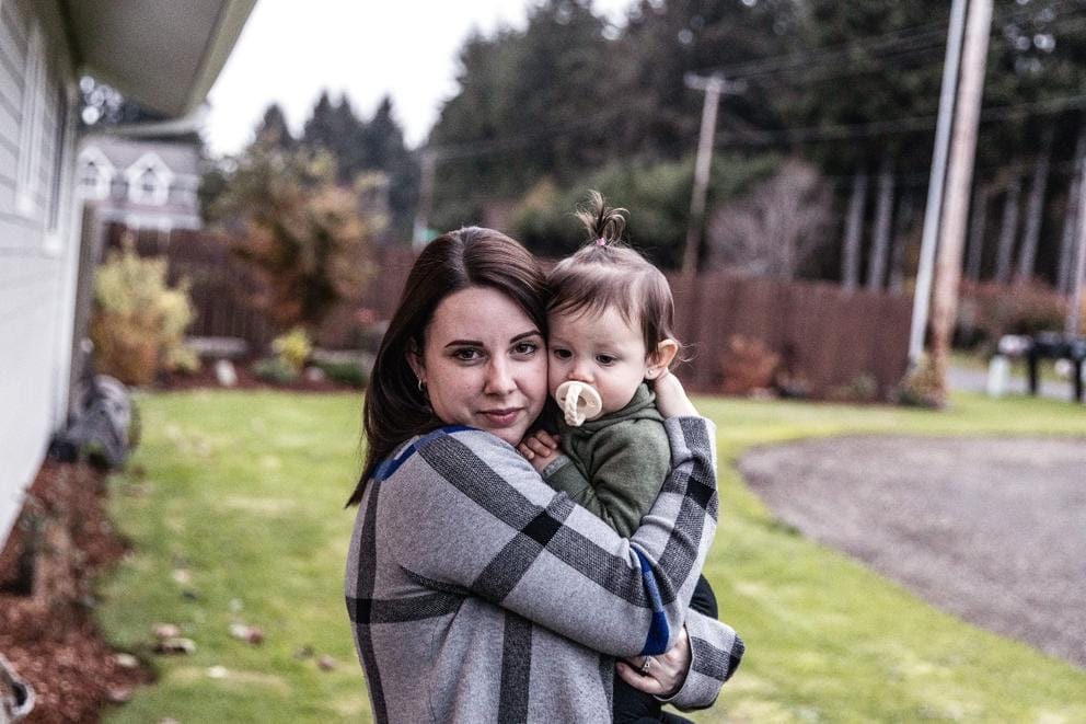 Kayla holding daughter