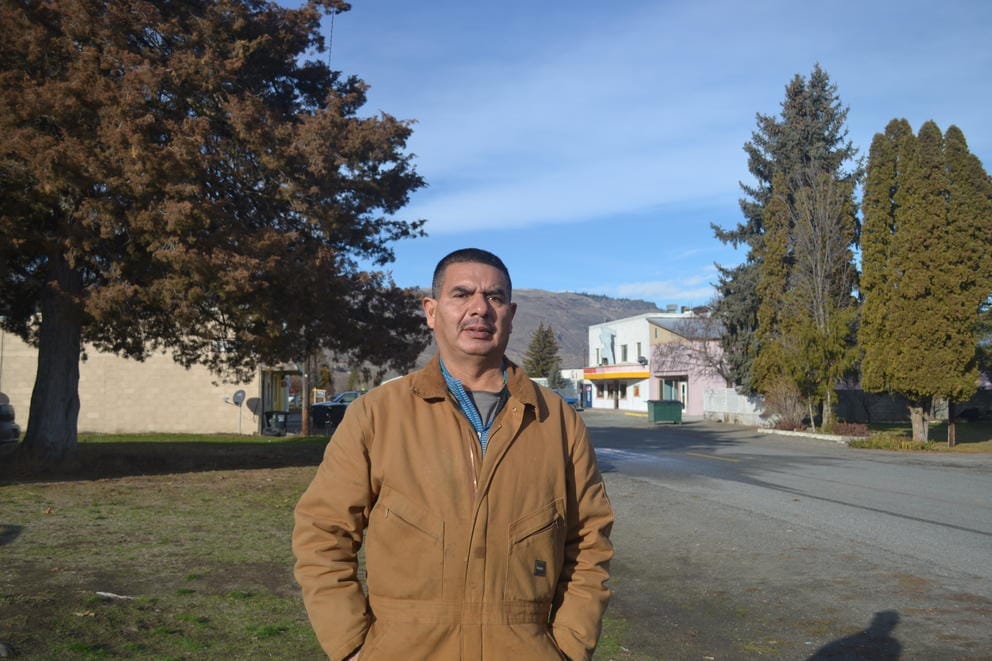 Manuel Farias outside his home in Bridgeport